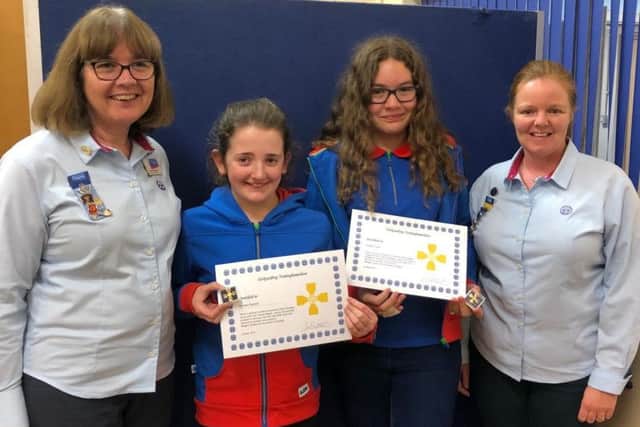 Georgia Randall and Abigail Cupit receiving their awards from Jackie Brocklehurst (left), Nottinghamshire Girlguiding County Commissioner, and Catherine Wills, Ashfield division commissioner.