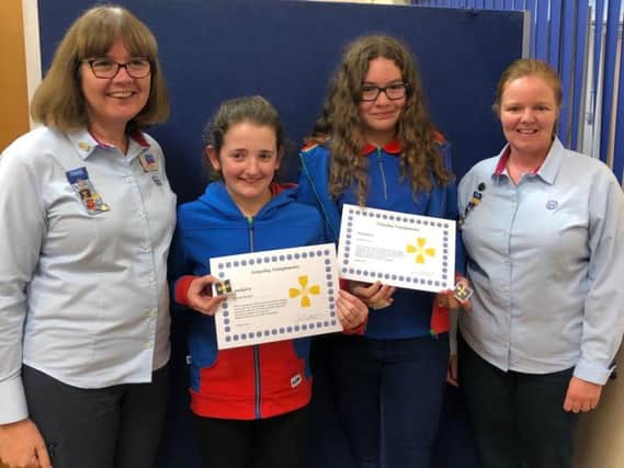 Georgia Randall and Abigail Cupit receiving their awards from Jackie Brocklehurst (left), Nottinghamshire Girlguiding County Commissioner, and Catherine Wills, Ashfield division commissioner.