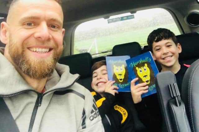 Leon with his two sons.