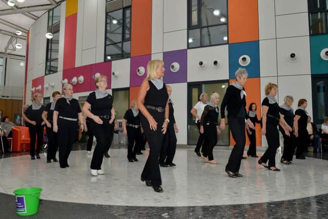 Buckles And Belts Line Dancing group performing at Kingâ¬"s Mill Hospital raising money for the hospitalâ¬"s scanner appeal