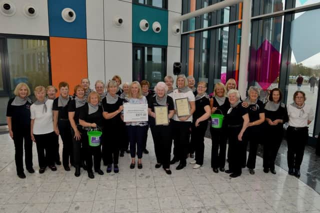 Buckles And Belts Line Dancing group performing at Kingâ¬"s Mill Hospital raising money for the hospitalâ¬"s scanner appeal, pictured is teacher Dorothy Hibberd with Dr Sue Geary, consultant radiologist and ladies of Buckles and Belts