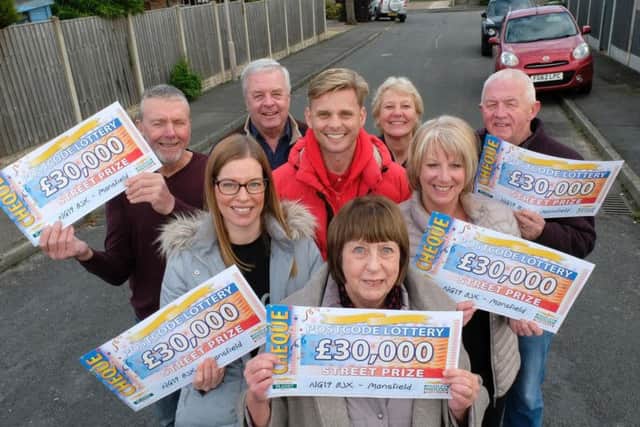 The lucky residents celebrate their win.
