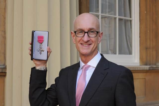 Mark Runacus receiving his MBE at Buckingham Palace.