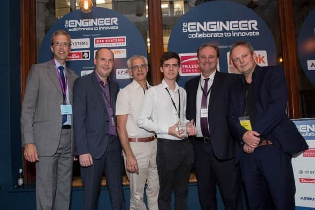 Phil Worsley, second from right, with other teachers and a student celebrating engineering success.