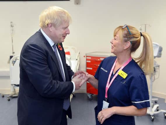 Boris Johnson visits Mansfield Kings Mill hospital. Boris Johnson speaking to specialist critical nurse Mandy.