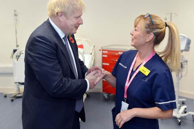 Boris Johnson speaking to specialist critical nurse Mandy .