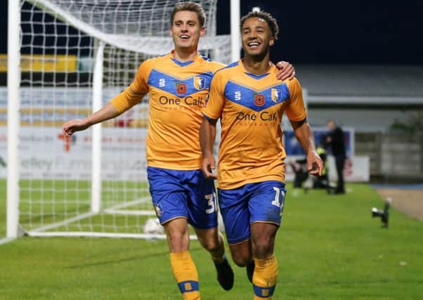 Mansfield Town forward Nicky Maynard celebrates his winner with his teammate Danny Rose.