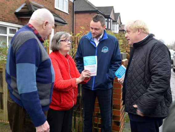 Boris Johnson and Ben Bradley speaking with residents in Mansfield.