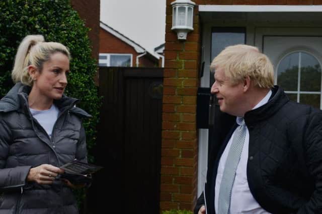Boris Johnson speaking with a resident in Mansfield.