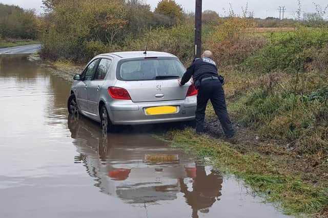 PC Kev Parsons helping the stranded motorist.