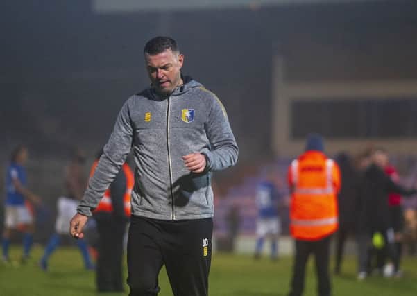 Picture Greg Dunbavand/AHPIX LTD, Football, Sky Bet League Two, Macclesfield Town v Mansfield Town, Moss Rose, Macclesfield, UK, 16/11/19, K.O 3pm

Mansfield manager John Dempster leaves the field after his sideâ¬"s 0-0 draw away at Macclesfield.

Howard Roe>07973739229