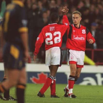 17 OCT 1994:  BRIAN ROY CELEBRATES WITH LARS BOHINEN AFTER HE SCORED NOTTINHAM FOREST's FIRST GOAL AGAINST WIMBLEDON IN THE FA PREMIERSHIP AT THE CITY GROUND IN NOTTINGHAM. Mandatory Credit: Mike Cooper/ALLSPORT