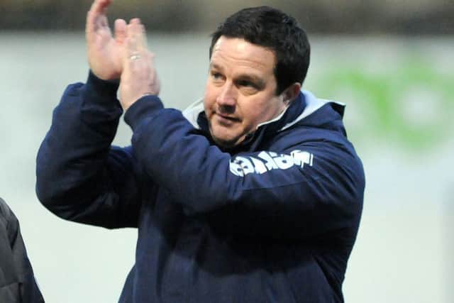 Mansfield Town v Barrow.Cox applauds the supporters.