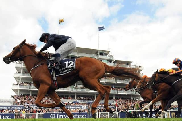 Ruler of the World ridden by jockey Ryan Moore comes home to win the Investec Derby during The Investec Derby Day at Epsom Downs Racecourse, Surrey PRESS ASSOCIATION Photo. Picture date: Saturday June 1, 2013. See PA Story RACING Epsom. Photo credit should read: Andrew Matthews/PA Wire.