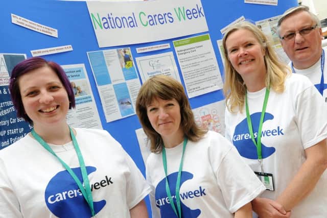 Stall in Idlewells Shopping Centre Sutton as part of National Carers Week. l-r Natasha Mellors and Zena Cameron from the Carers Federation, Kate Whittaker NCC, Steve Shaw Ashfield Voluntary Action.