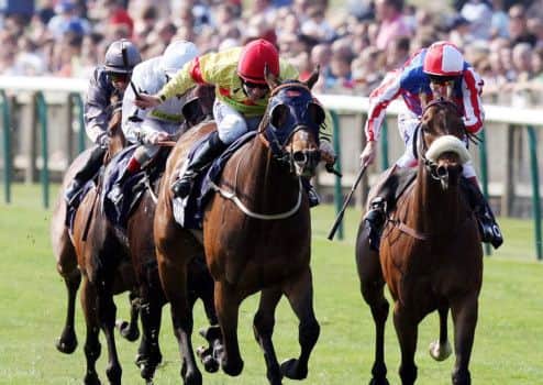 Tangerine Trees (yellow shirt and red cap) ridden by Tom Eaves wins the Pearl Bloodstock Palace House Stakes during the The QIPCO Guineas Festival at Newmarket Racecourse. PRESS ASSOCIATION Photo. Picture date: Saturday April 30, 2011. See PA story RACING Newmarket. Photo credit should read: Steve Parsons/PA Wire.