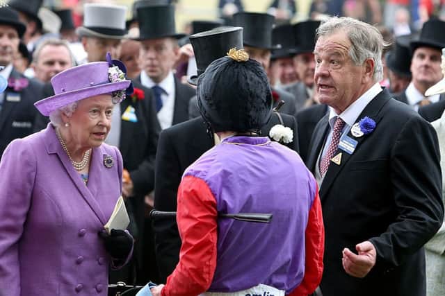 Queen Elizabeth II speaks with jockey Ryan Moore (centre) and Trainer Sir Michael Stout after victory in the Gold Cup on day three of the Royal Ascot meeting at Ascot Racecourse, Berkshire. PRESS ASSOCIATION Photo. Picture date: Thursday June 20, 2013. See PA story RACING Ascot. Photo credit should read: Steve Parsons/PA Wire