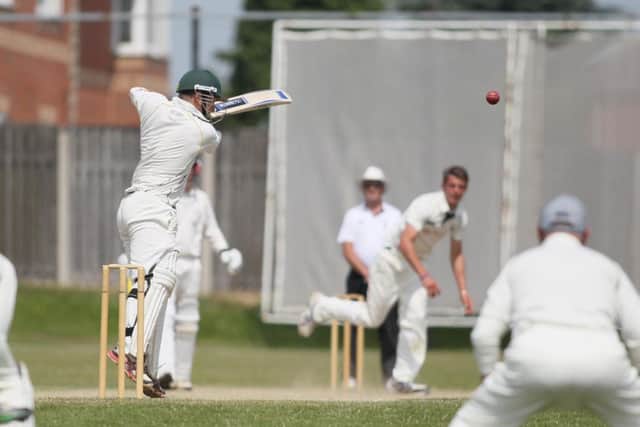 Gareth Curtis steers the ball to safety under pressure from the Academy attack -Pic by:Richard Parkes