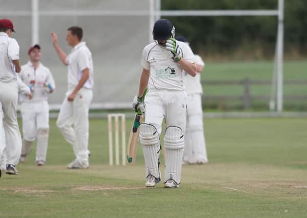 Will Butler is duly dispatched to the dressing rooms following lbw by Ryan McFadean  -Pic by:Richard Parkes