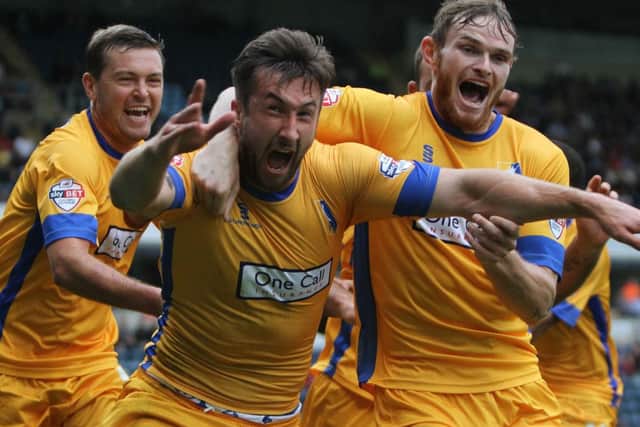 The celebrations begin as Ollie Palmer (centre) and his teammates celebrate after Palmer nets the winning goal.