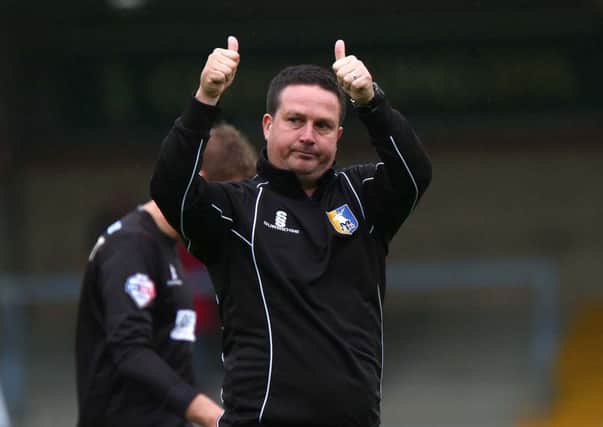With the season's first win chalked up, manager Neil Cox gives a big thumbs up to the Stags' fans at the final whistle.
