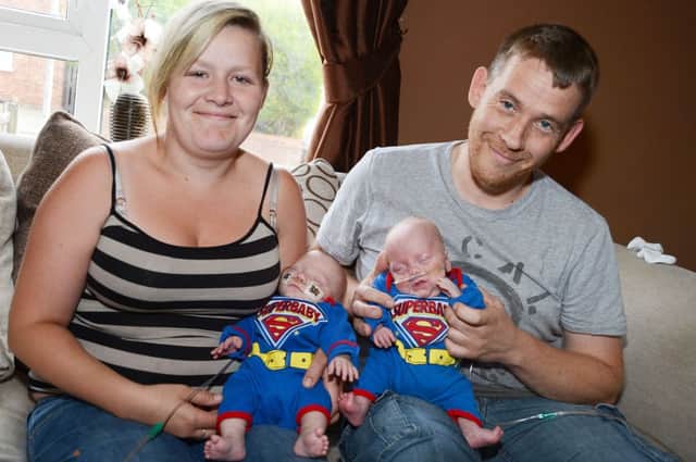 Shona Machin with her son Jacob and Graham Devonshire with his son Finley.