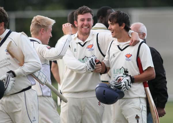 All smiles for Lewis Bramley (right) as he team mates congratulate him after his  match winning six   -Pic by:Richard Parkes