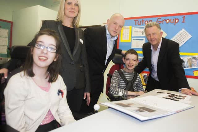 Rachel Hall, Malcolm Hall and principal Mark Dengel with pupils Tia Jackson and Mark Guy at Fountaindale Special School in Mansfield.