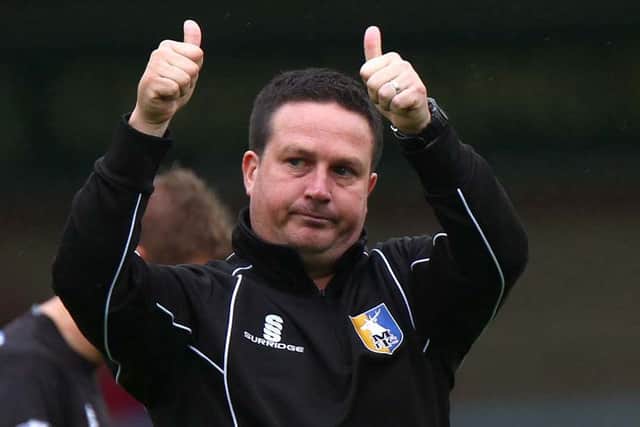 With the season's first win chalked up, manager Neil Cox gives a big thumbs up to the Stags' fans at the final whistle.
