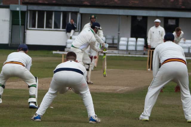 Ben Summerville bowls to Jason Gorman while the field waits in anticipation