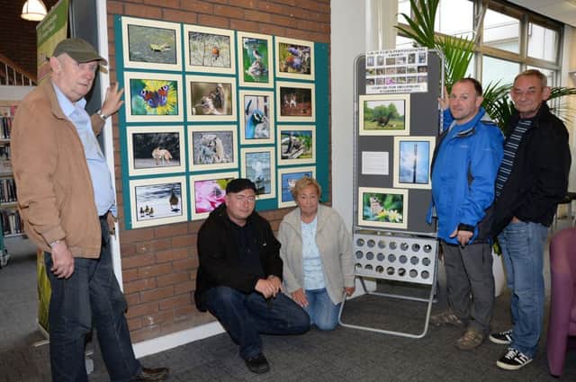 A group of adults with mental health problems have put on a photography exhibition at Sutton library G130909-1a