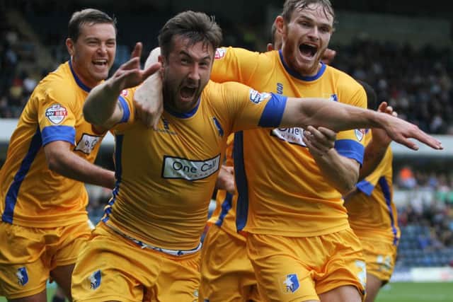 The celebrations begin as Ollie Palmer (centre) and his teammates celebrate after Palmer nets the winning goal.