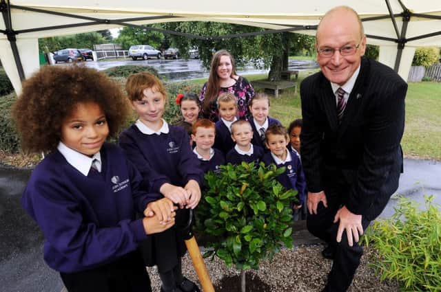 Barry Day Chief Executive of Greenwood Dale Foundation Trust visits Skegby Junior Academy for the opening. Helping with a tree planting, front are, Ty Smith 9 and Lauren Niblett 8.