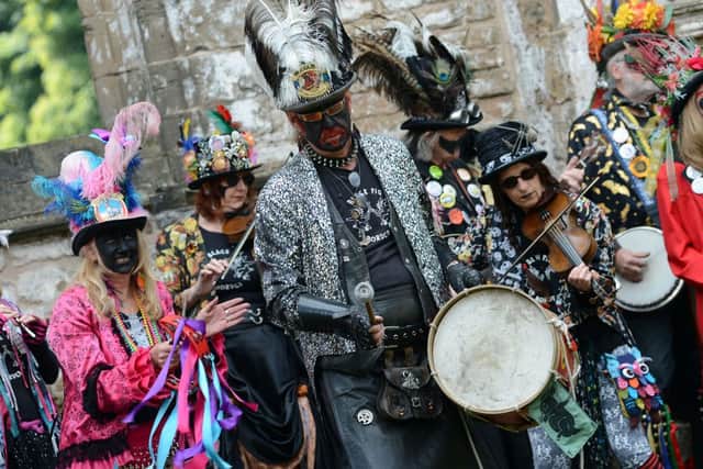 Falling Leaves Folk Festival.Black Pig Border Morris members bring a splash of colour to proceedings.