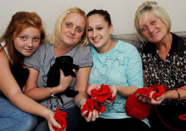A family in Hucknall are crocheting poppys for this Remembrance Day, they are appealing for more red wool donations. l-r Charlotte Upson 12, Ruth Upson, Ana Bosano 19 and Kate Wells.