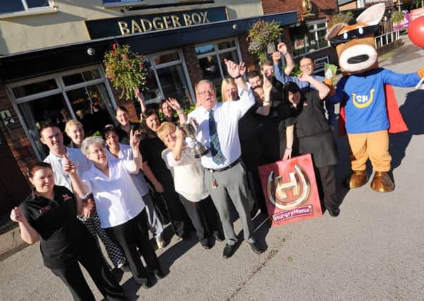 The Badger Box in Annesley has been awarded with The Hungry Horse Pub of the Year Award. Pictured front is landlord and landlady Glenis and Ian Rooks.