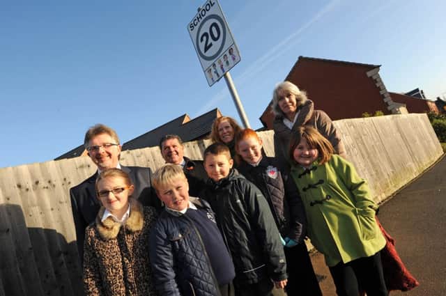 Robin Hood Primary School, Mansfield Woodhouse are the first school in the county to introduce a 20mph speed limit on the road. Pictured with children from the school l-r is Alan Rhodes Leader of County Council, Kevin Greaves Chair of Transport, Cllr Joyce Bosnjak and Pauline Witham Chair of Governers.