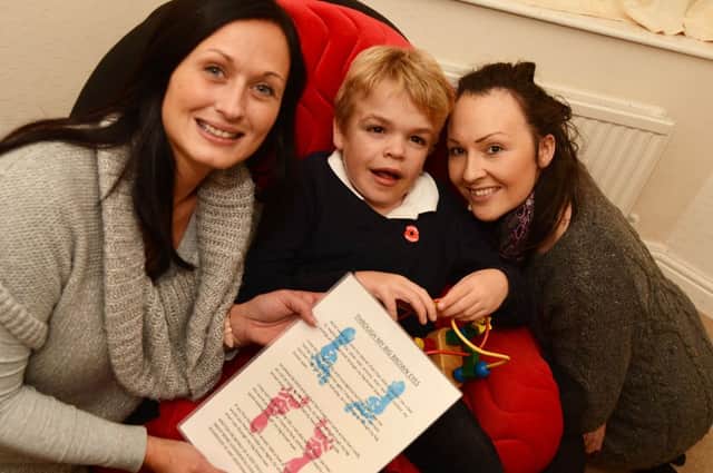 Jacob Brentnall with his mum Hannah, right and Donna Corcoran who has written a poem about him.