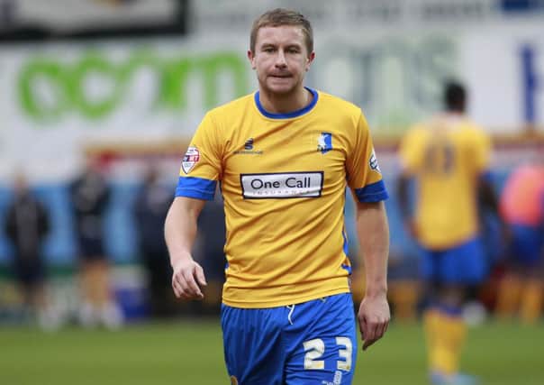 Jamie McGuire walks towards the tunnel after he is shown the red card  -Pic by:Richard Parkes