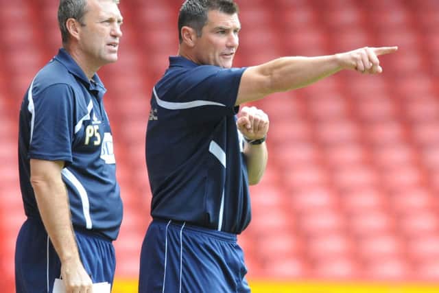 Richie Barker, seen here with assistant Peter Shirtliff during his time managing Bury, has adapted well to life in the dug-out.