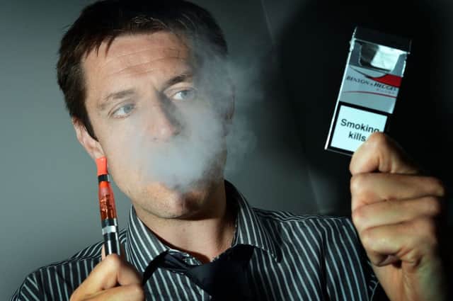 Nick Frame with electronic cigarette.