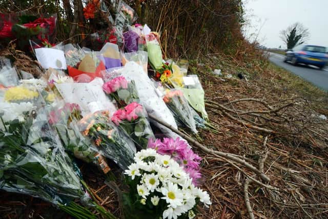 Floral tributes to Adam Smith and Guy Bennett on Main Road, Ravenshead.