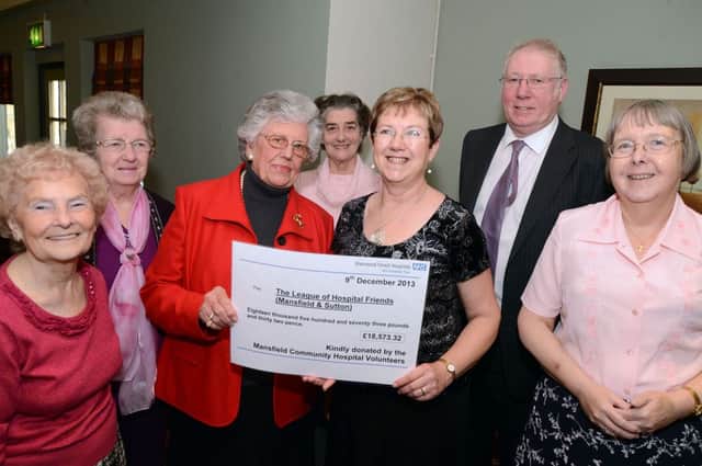 League of Friends volunteers who were honoured with long service awards, help with the presentation of funds totalling £18,573.32 from tea bar sales to Barbara Joule the group's Chairman at a special awards ceremony held at the Rushley on Monday.  Pictured from left are  Mavis Crookes, Elizabeth Ellis, Barbara Joule, Maureen Kenworthy, Linda Swann, Sean Lyons Chairman of the Sherwood Hospitals Trust and Lynda Woodward.