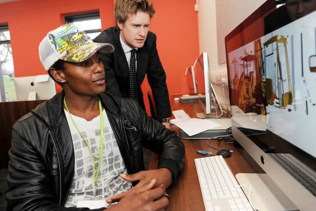Shadow Education Minister Tristram Hunt visits West Notts College. Pictured with Dennis Nyamanhiadi a Foundation Degree Interactive Media student, they are looking at Dennis' work using 3D software.