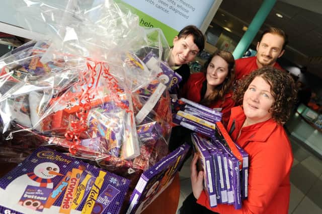 Sam Spencer (far left) from Pasic collecting over 100 selection boxes from Lammas Leisure Centre for poorly children. With Laura Lacey, Jimmy Lindley and Sharon Tasker from Lammas.