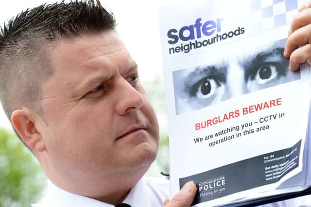 Insp Nick Butler with the Nottinghamshire Police poster.