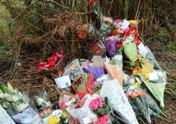 Floral tributes to Adam Smith and Guy Bennett on Main Road, Ravenshead.