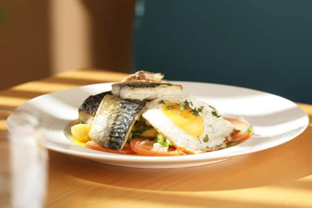 Seabass with Bombay potatoes and fried egg. PA Photo/Fish is the Dish.