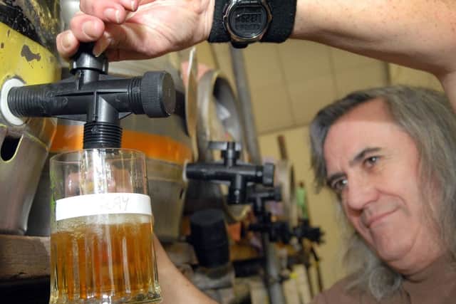 NHUD11-0311-3Hucknall Beer Festival, John Godber Centre.Nottinghamshire's CAMRA Social Secretary Ray Kirby mans the pumps.