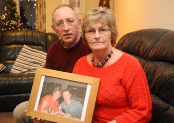 3rd January 2014PHOTO CREDIT SHOULD READ: MATTHEW PAGE23 Falcon Way, Hucknall, NG15 8HHPictured: Lorraine and Chris Higham who are appealing for help finding their son Stuart Higham (pictured in photograph).The 3rd anniversary of his disappearance is this Saturday.
